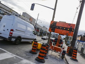 A lane of traffic is closed on Eglinton Ave. west bound at Avenue Rd. in Toronto on Friday September 30, 2016. Dave Thomas/Toronto Sun/Postmedia Network