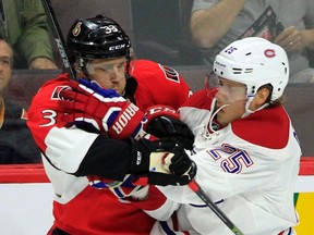 Ottawa Senators' Fredrik Claesson gets tangled up with Montreal Canadiens' Jacob De La Rose on Oct. 1 at the Canadian Tire Centre. (THE CANADIAN PRESS/Fred Chartrand)