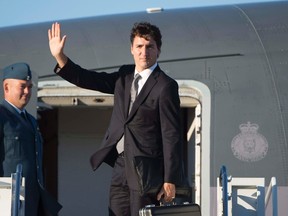 Canadian Prime Minister Justin Trudeau boards a government plane in Ottawa, Thursday September 29, 2016. (THE CANADIAN PRESS/Adrian Wyld)