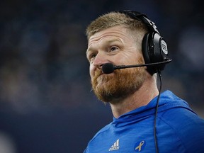 Winnipeg Blue Bombers head coach Mike O'Shea grimaces after watching a reply of an Edmonton Eskimos' interception during the second half of CFL action in Winnipeg Friday, September 30, 2016. (THE CANADIAN PRESS/John Woods)