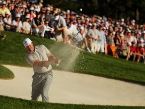 Lee Westwood of Europe plays a shot from a bunker on the 16th hole during afternoon fourball matches of the 2016 Ryder Cup at Hazeltine National Golf Club on October 1, 2016 in Chaska, Minnesota. (Streeter Lecka/Getty Images)