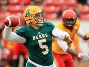 University of Alberta Golden Bears quarterback Ben Kopczynski lines up a pass during Canada West football action against the U of C Dinos at McMahon Stadium in Calgary on Saturday Oct. 1, 2016.