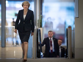 Britain's Prime Minister Theresa May arrives ahead of a TV interview at BBC studios in Birmingham, England, before the start of the annual Conservative party conference, Sunday Oct. 2, 2016. During the interview May said Britain will trigger the Article 50 formal process for leaving the European Union, Brexit, before the end of March 2017, setting the nation on a course to leave the 28-nation European trading bloc by 2019. (Stefan Rousseau / PA via AP)