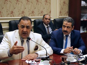 In this Sept. 8, 2016, photo, Egyptian Parliamentary member Ilhami Agena, left, attends the human rights committee in Cairo, Egypt. An independent Egyptian daily says the state’s top women’s advocacy group has filed a complaint with the chief prosecutor against the lawmaker who called for mandatory virginity tests for women seeking university admission. (AP Photo/Lobna Tarek)
