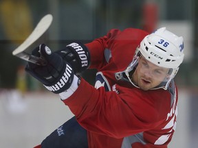 Winnipeg Jets defenceman Josh Morrissey fires a shot on net during NHL hockey practice in Winnipeg, Man. Saturday, Sept. 24, 2016. (Brian Donogh/Winnipeg Sun/Postmedia Network)