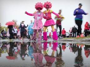 Nick Paquin, left, and Tristan Leblanc ham it up for a photo prior to the start of the Canadian Breast Cancer Foundation CIBC Run for the Cure in Ottawa on Sun., October 2, 2016. The pair have participated in the race for a number of years in support of Paquin's mother who is a breast cancer survivor. (Jason Ransom / Ottawa Citizen)