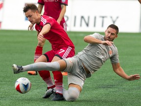 Ottawa Fury FC's Ryan Williams (left) battles for the ball against Puerto Rico FC's Tyler Rudy (right) at TD Place in Ottawa on Sunday, Oct. 2, 2016. (Ashley Fraser/Postmedia)