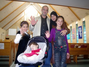 Syrian refugees Mohamad and Manal Mira, with their daughters from left Mayam,9, Sama, 11 months and Maysam, 10, say they grateful for all help they have received in their new home. (HEATHER RIVERS, Sentinel-Review)