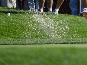 United States’ Rickie Fowler hits from a bunker on the first hole during a singles match at the Ryder Cup at Hazeltine National Golf Club in Chaska, Minn., on Sunday, Oct. 2, 2016. (Chris Carlson/AP Photo)