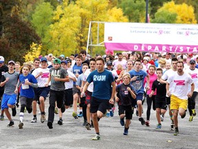 Participants take to the  start of the Canadian Breast Cancer Foundation CIBC Run for the Cure at Cambrian College on Sunday. (Gino Donato/Sudbury Star)