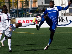 Tomi Ameobi battles for the ball with a member of the Indy Eleven during Sunday's game at Clarke Stadium. (David Bloom)