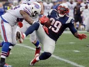 Bills linebacker Zach Brown (left) tackles Patriots running back LeGarrette Blount (29) during second half NFL action in Foxborough, Mass., on Sunday, Oct. 2, 2016. (Elise Amendola/AP Photo)