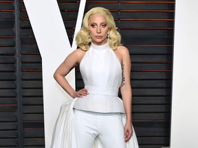 In this Feb. 28, 2016 file photo, Lady Gaga arrives at the Vanity Fair Oscar Party in Beverly Hills, Calif. Lady Gaga is choosing the intimacy of dive bars over arenas to showcase songs from her new album, "Joanne." She'll appear at a handful of bars beginning this week as a nod to the album's "raw Americana" vibe and where she got her start, Gaga and tour partner Bud Light announced Sunday, Oct. 2, 2016. (Photo by Evan Agostini/Invision/AP, File)