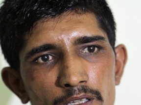 In this photo taken on Thursday, Sept. 1, 2016, Mubeen Rajhu, who killed his sister, talks to the Associated Press in Lahore, Pakistan. (AP Photo/K.M. Chaudary)