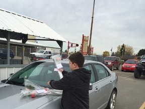 Easyford resident Jennifer Smith along with her two sons 10-year-old Keegan Smith (above) and eight year old Mason Smith put flowers, kindness cards and coupons on random cars in Drayton Valley recently. The mother wanted her two sons to learn about kindness.