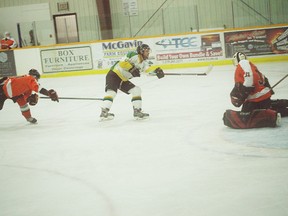 Colin Hartwick rifles a wrist shot to beat Shallow Lake Crushers’ goaltender to score the first goal of the game for the Huron East Centenaires. He ended up scoring a hat trick. (Shaun Gregory/huron Expositor)