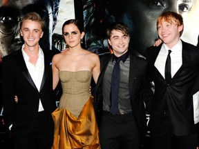 FILE - In this July 11, 2011 file photo, cast members, from left, Tom Felton, Emma Watson, Daniel Radcliffe and Rupert Grint pose together at the premiere of "Harry Potter and the Deathly Hallows: Part 2" at Avery Fisher Hall in New York. Warner Bros. said on Oct. 3, 2016, that all 8 Harry Potter films will be re-released in theaters for a one-week run beginning Oct. 13, 2016.
