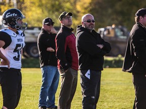 Cats football head coach Kevin Babiuk (right) during the final quarter of a game against the Sexsmith Sabres on Sept. 19.

Hannah Lawson | Whitecourt Star