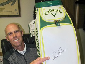 Garrison Golf & Curling Club professional Dale Pedersen with his Callaway Arnold Palmer Staff Bag Masters Limited Edition on Monday. The legendary golfer, who died last week at age 87, autographed the flap of the ball pocket on the commemorative bag, which Callaway manufactured in 2014 to salute the 50th anniversary of the last of Palmer's four Masters championships. (Patrick Kennedy/The Whig-Standard)