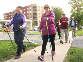 A group of pole walkers make their way along Wright Crescent. The Kingston YMCA is holding classes in pole walking, an exercise that is gaining in popularity. (Michael Lea/The Whig-Standard)