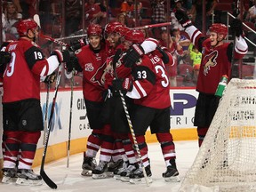 Shane Doan #19 (L) of the Arizona Coyotes celebrates with teammates Brendan Perlini #29, Dylan Strome #20, Anthony Duclair #10, Alex Goligoski #33 and Jakob Chychrun #6 after Doan scored the game winning goal against Anaheim Ducks in overtime of the preseason NHL game at Gila River Arena on October 1, 2016 in Glendale, Arizona. The Coyotes defeated the Ducks 3-2 in overtime. (Photo by Christian Petersen/Getty Images)