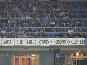 Blue Jays fans display a sign in the upper deck expressing optimism about their team's chances of winning a wild card during MLB action against the Orioles at the Rogers Centre in Toronto on Sept. 29, 2016. (Tom Szczerbowski/Getty Images)
