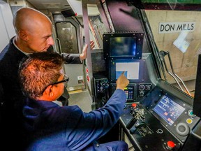 TTC CEO Andy Byford gets hands-on demonstration at Don Mills Station by senior instructor Roy Lalkissoon on the new One-Person Train Operation (OPTO) system Monday, October 3, 2016. (Dave Thomas/Toronto Sun)