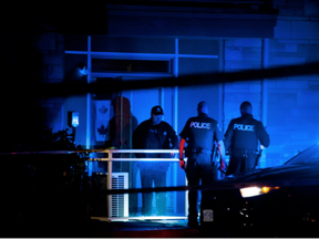 Ottawa Police Guns and Gangs detectives, uniform officers and Canine were on Ohio Street near the Billings Bridge area of Ottawa after a shooting took place Sunday October 2, 2016. (Ashley Fraser, Postmedia)