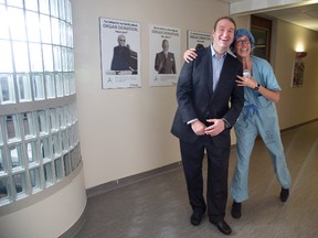 Transplant surgeon and researcher Dr. Anton Skaro is photo-bombed by transplant donor co-ordinator Corrine Weernink at University Hospital in London. He began working at UH last month. (DEREK RUTTAN, The London Free Press)