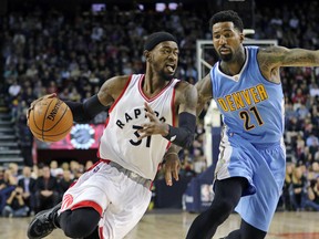 Raptors’ Terence Ross looks to go around the Nuggets’ Wilson Chandler during their NBA game in Calgary on Monday. (Postmedia Network)