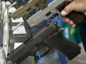 File photo of semi-automatic handguns displayed at the143rd NRA Annual Meetings and Exhibits at the Indiana Convention Center in Indianapolis, Indiana on April 25, 2014.(KAREN BLEIER/AFP/Getty Images)