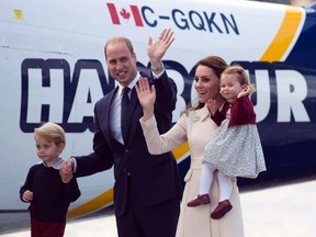 William and Kate, the Duke and Duchess of Cambridge along with their children Prince George and Princess Charlotte get on a float plane as they prepare to depart Victoria, British Columbia, Canada, on Saturday, Oct. 1, 2016. (Jonathan Hayward/The Canadian Press via AP)