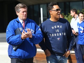 Mayor John Tory with Jays Alumnai Roberto Alomar as they raise the Blue Jays Flag at City Hall in Toronto, Ont. on Tuesday October 4, 2016. Dave Abel/Toronto Sun/Postmedia Network