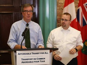 Ottawa Mayor Jim Watson, left, and transit commission chair Coun. Stephen Blais announce the new low-income pass plan for OC Transpo riders. JEAN LEVAC / POSTMEDIA NEWS