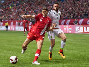 Dejan Jakovic of Canada battles Miguel Layun of Mexico for the ball during FIFA 2018 World Cup Qualifier soccer action at BC Place on March 25, 2016 in Vancouver, Canada. (Rich Lam/Getty Images)