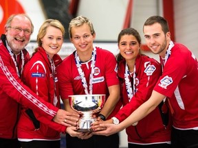 Sander Roelvaag (centre) guided a Norweigian team to a gold medal at the world university curling championships. (World Curling Federation)