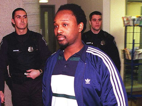 Robert Sarrazin surrenders to police in the shooting of Apaid Noel in this 1998 file photo