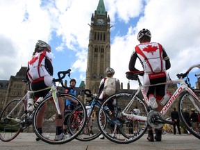 Cycling enthusiasts gather on Parliament Hill to promote bike-friendly infrastructure as a national issue, in Ottawa, Monday, June 3, 2013. (THE CANADIAN PRESS/Fred Chartrand)