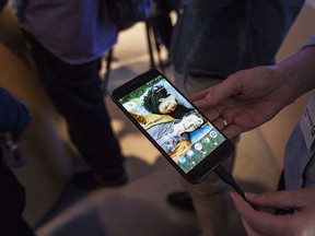 Members of the media examine Google's Pixel phone during an event to introduce Google hardware products on Oct. 4, 2016 in San Francisco.(Photo by Ramin Talaie/Getty Images)