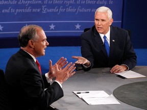 Democratic vice presidential nominee Tim Kaine (L) and Republican vice presidential nominee Mike Pence (R) speak during the Vice Presidential Debate at Longwood University on October 4, 2016 in Farmville, Virginia. This is the second of four debates during the presidential election season and the only debate between the vice presidential candidates. (Photo by Andrew Gombert - Pool/Getty Images)