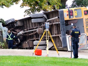 The driver of this school bus was pronounced dead at the scene after crashing into a tree on Twelve Mile Road east of Adelaide Street north of London. (DEREK RUTTAN, The London Free Press)