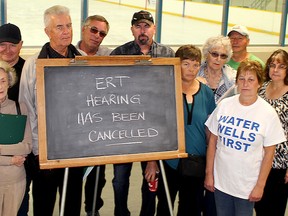 This group of residents are upset an environmental review tribunal regarding concerns about the potential impact of a wind farm in Chatham Township could have on water wells has cancelled. They only learned some kind of mediated settlement had been reached after showing up at Thames Campus Arena in Chatham, Ont. on Wednesday October 5, 2016 for what they expected would be the first day of hearings. (Ellwood Shreve/Chatham Daily News/Postmedia Network)