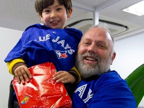 Tim Terstege holds his son Liefie at a lawyer's office in Yokohama, Japan, in February 2015, the last time they were together. Terstege is one of dozens of Canadian parents deprived of access to their children in Japan. (THE CANADIAN PRESS/HO)