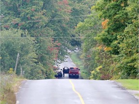 First responders at the isolated site of a fatal domestic altercation and fire near Kingston on Tuesday. ELLIOT FERGUSON/POSTMEDIA