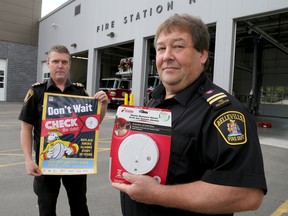 Emily Mountney-Lessard/The Intelligencer
Belleville Fire Department senior fire prevention officer John Lake, back, and fire prevention officer Corey Davis promote Fire Prevention Week (kicking off this Sunday, Oct. 9), at Station No. 1, on Wednesday.