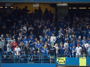 A general view of fans in the stands behind left field at the Rogers Centre in Toronto, Tuesday, Oct.4, 2016, shortly after a beer can landed in the outfield near Baltimore Orioles leftfielder Hyun Soo Kim in the seventh inning of the wild-card game against the Toronto Blue Jays. (THE CANADIAN PRESS/Frank Gunn)