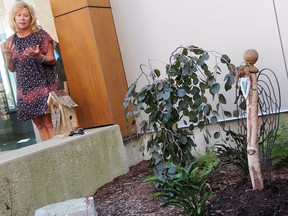 Michelle Weber, whose son's organs were donated to six people after he died in 2008, speaks at the official opening of the SODA Garden of Life Wednesday at Bluewater Health in Sarnia. An angel sculpture was dedicated in the garden to organ donors, and in memory of SODA board member Donna Stewart, who died in June. (Tyler Kula/Sarnia Observer)