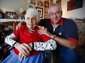 Sophie Nemis, 99, is photographed in her Winnipeg home with her son Daniel, Wednesday, October 5, 2016. Nemis went into hospital for a sprained ankle, and after a lengthy stay, her son Daniel received a phone call from a nurse who informed him his mother had died during the night. This was obviously a mistake and Nemis plans to celebrate her 100th birthday in December. THE CANADIAN PRESS/John Woods
