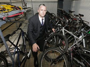 Edmonton Police Service Staff Sgt. Jonathan Coughlan (Criminal Investigation Division, Northwest Division) with some recovered stolen bicycles at a police storage facility on Edmonton on October 5, 2016. Six adults have been charged after police discovered a bicycle chop shop in the city. (Photo by Larry Wong/Postmedia)