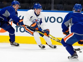 Drake Caggiula, right, runs a drill with Connor McDavid Wednesday during Oilers practice at Rogers Place. (David Bloom)